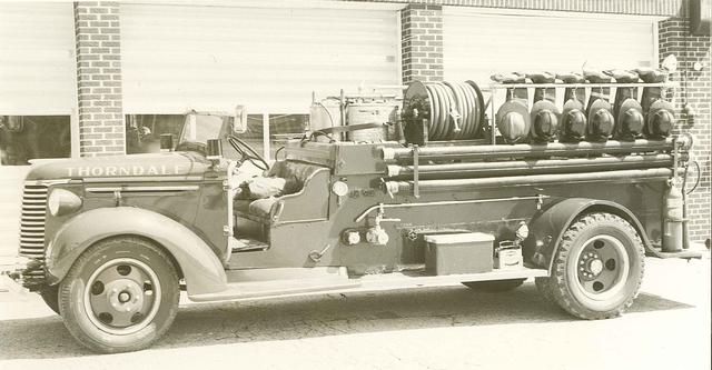 1978 - 1939 Chevy Engine parked in front of our 1949 Firehouse